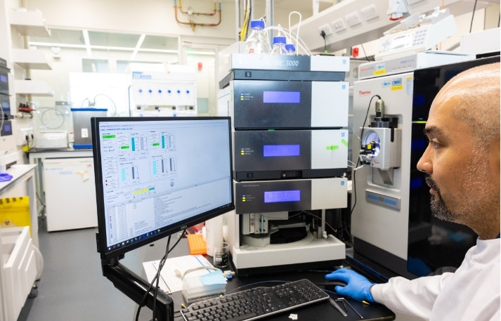 Left & Right Website Image Block Template Proteomics facility technician at work