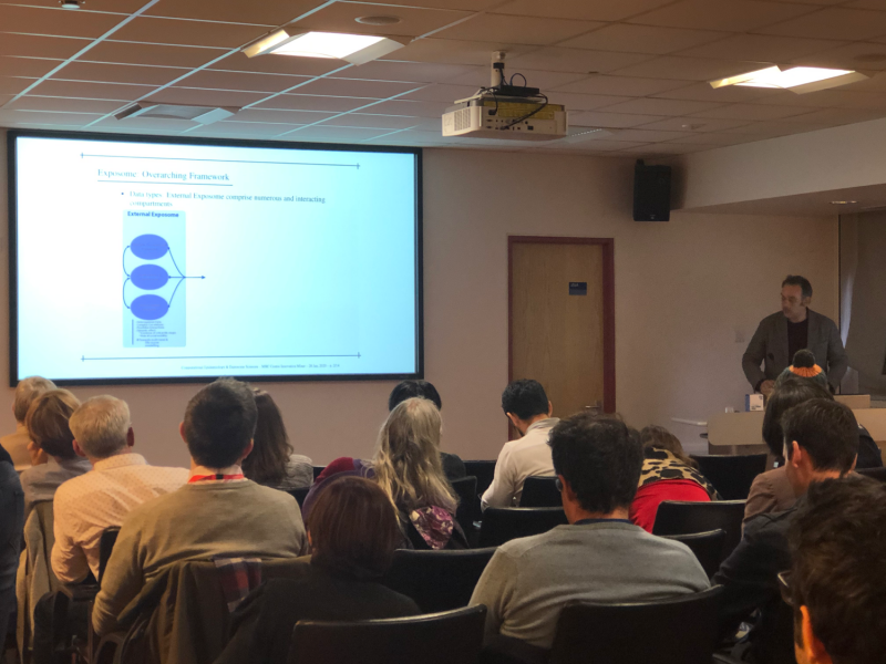 Group watching presentation at Mixing environmental health with medical science event