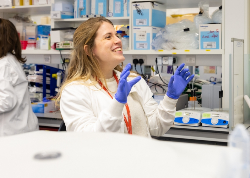 lms-post-doc-sub-banner LMS researcher sat at desk with gloves on